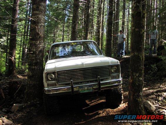 White 1973 Chevrolet K5 Blazer front view off-roading in forest