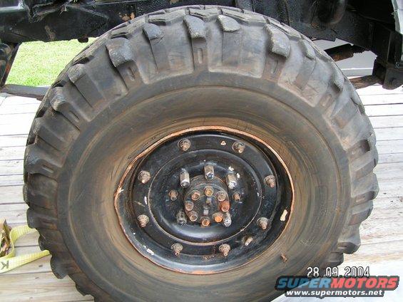 Close-up of a large off-road tire with a multi-lug wheel hub