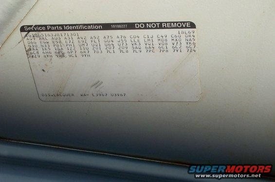 Service parts identification sticker on a car door jamb