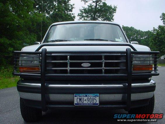 White Ford Bronco with black grille guard and New York license plate CMU-9085