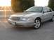 2004 Ford Crown Victoria - This sedan has a distinctive grille and headlight design, consistent with a 2004 model year.