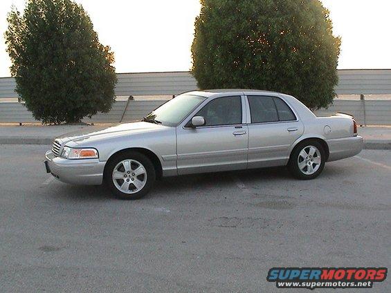 Silver 2004 Ford Crown Victoria sedan, side view