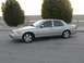 2004 Ford Crown Victoria - Side profile of a silver 2004 Ford Crown Victoria sedan parked outdoors.