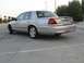 2004 Ford Crown Victoria - Rear view of a silver 2004 Ford Crown Victoria showing its distinctive taillights and spoiler.