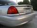 2004 Ford Crown Victoria - The rear of a silver Ford Crown Victoria is shown with a spoiler and a license plate.
