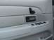 2004 Ford Crown Victoria - Close-up of a car's interior door panel, showing various electronic controls.