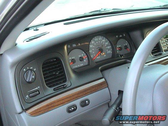 2004 Ford Crown Victoria dashboard with gauges, vents, and steering column