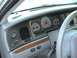 2004 Ford Crown Victoria - Interior view of a 2004 Ford Crown Victoria dashboard, showing the instrument cluster and controls.