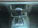 2004 Ford Crown Victoria - The automatic transmission shifter and dashboard controls are visible in this interior shot.