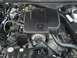2004 Ford Crown Victoria - Close-up view of the engine compartment, showing various mechanical components and wiring.