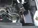 2004 Ford Crown Victoria - Close-up view of the engine bay, showing the air intake system and various hoses.