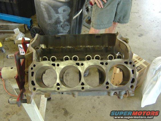 Engine block on stand, showing cylinder bores and internal components