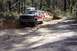 1982 Ford Bronco - Off-road adventure with a classic SUV on a challenging dirt path. Another vehicle is seen in the distance.