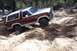 1982 Ford Bronco - Ford Bronco tackling challenging terrain on an off-road trail.