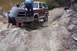 1982 Ford Bronco - 1982 Ford Bronco tackles a difficult off-road obstacle with help from passengers.