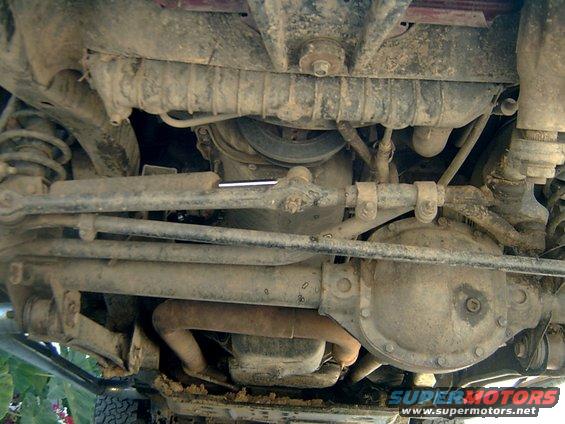 1998 Jeep TJ front axle, steering linkage, and exhaust pipe