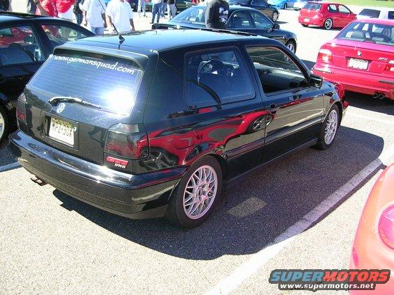 Black 1996 Volkswagen Golf GTI with a rear spoiler and tinted windows