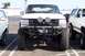 1990 Ford Bronco - Front view of a modified white Ford Bronco from the early 1990s, parked alongside another similar vehicle.