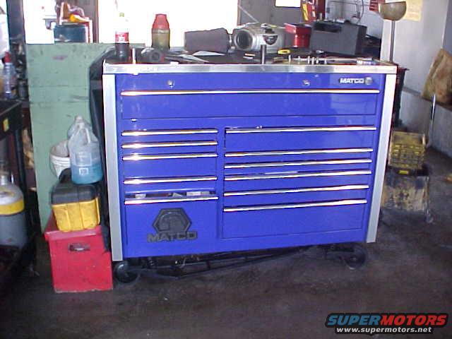Blue Matco tool chest with multiple drawers and a red toolbox below it
