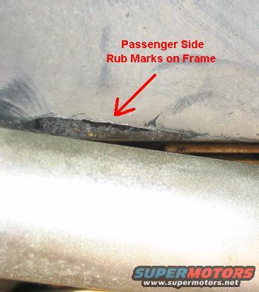 Close-up of passenger side frame with rub marks and damage