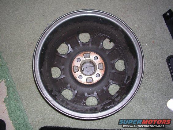 Car wheel rim with multiple lug nut holes and center cap area