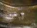 1981 Ford Bronco - A differential fluid plug is visible in murky fluid, suggesting a maintenance issue.