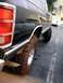 1984 Dodge Ram Van - This 1984 Dodge Ram Van features a rear view with prominent off-road tires, suggesting modifications for terrain.