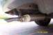 1996 Mercury Sable - The rear exhaust system of a vehicle is shown, including the muffler and a chrome-tipped tailpipe.