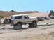 1988 Ford Bronco - This 1987 Ford Bronco is navigating a rocky off-road course under a clear blue sky.