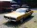1970 Mercury Cougar - Gold 1970 Mercury Cougar with a black vinyl top sits in a driveway.
