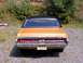 1970 Mercury Cougar - Rear view of a 1970 Mercury Cougar, showing its distinctive taillight bar and chrome bumper.