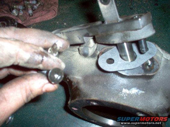 2-bottom-pin.jpg Preinstall the bottom pin & weight on the knuckle, using a new gasket.  The screws have  T-40 heads.