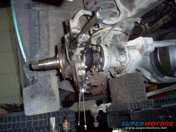 50-shield-bolts.jpg Reinstall the brake shield, using a 19mm for the stop bolt's nut, & an 8mm and 10mm for the bottom.