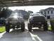 Dodge next to friends ford f250 with 10" lift and 40's