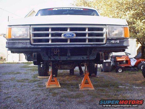 Front view of 1988 Ford Bronco on jack stands, showing suspension components