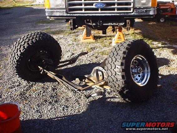 1988 Ford Bronco front suspension and tires removed, vehicle on jack stands