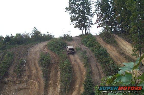 dcp_2744.jpg Rick Wojo climbing the hills after several failed attempts at more difficult paths.