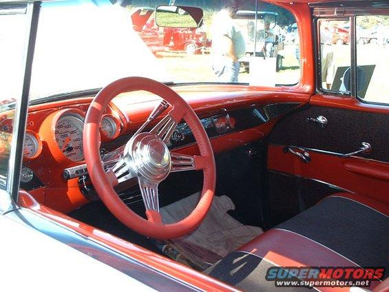 Red interior with custom steering wheel and gauges
