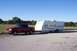 2002 Ford Sport Trac - A red 2002 Ford Sport Trac is seen towing a travel trailer on a sunny day.