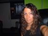 woman taking a selfie indoors, blurry background