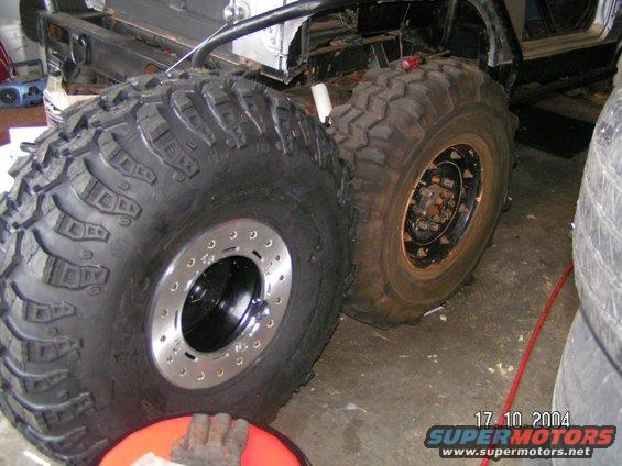 Close-up of large off-road tires and vehicle chassis