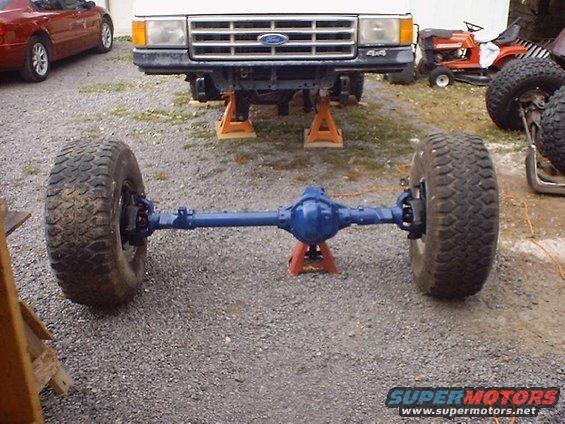 1988 Ford Bronco front axle assembly with tires, blue differential