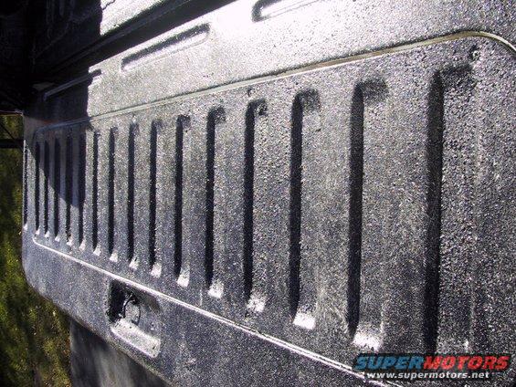 close-up of textured truck bed liner with vertical ridges