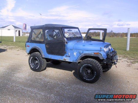 Blue Jeep CJ-7 with doors removed