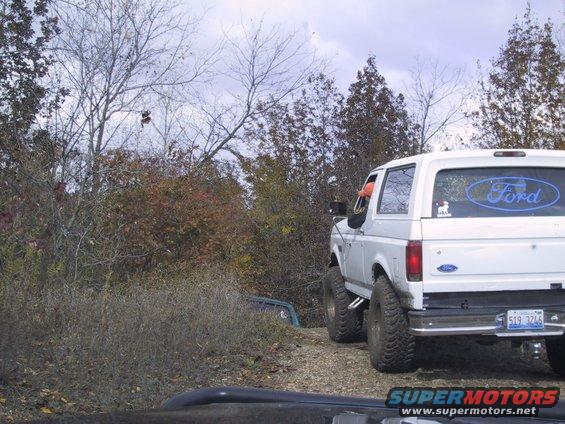 White 1993 Ford Bronco rear view with blue Ford logo on window