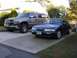 1995 Nissan 240SX - A 1995 Nissan 240SX is parked in front of a Chevrolet Silverado pickup truck.