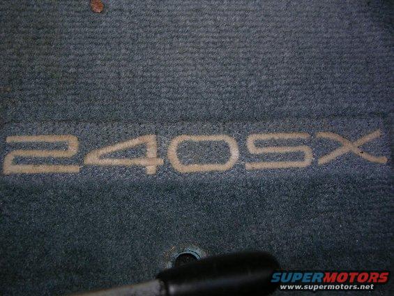 Car floor mat with embroidered '240SX' text