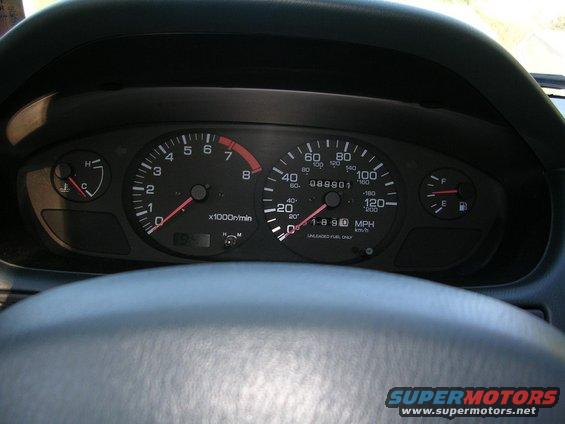 Dashboard gauges with tachometer, speedometer, fuel, and temperature gauges visible. Odometer reads 088901