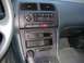 1995 Nissan 240SX - Interior view of a 1995 Nissan 240SX dashboard, showing the center console with audio and climate controls.