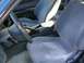 1995 Nissan 240SX - The interior of a car, gray cloth seats and a view of the dashboard and steering wheel.